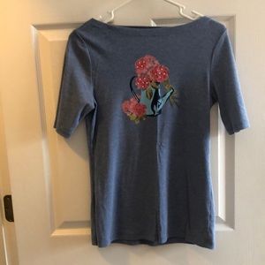 Light blue small shirt.